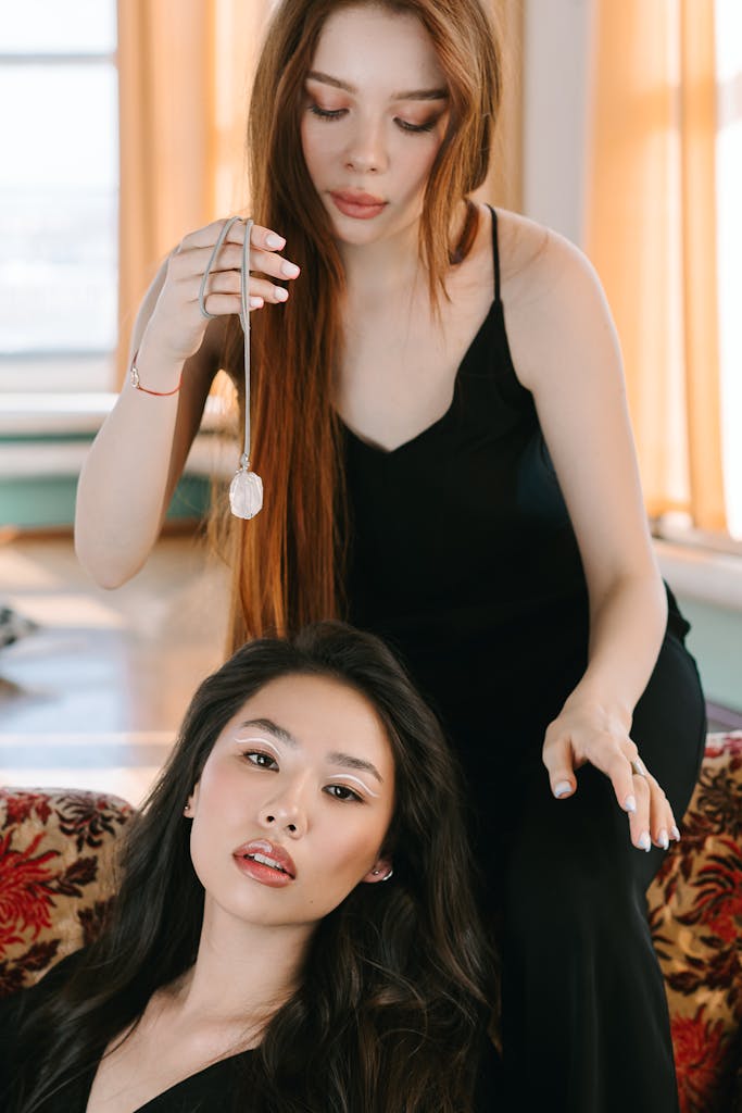 A Woman Hypnotizing Another Woman